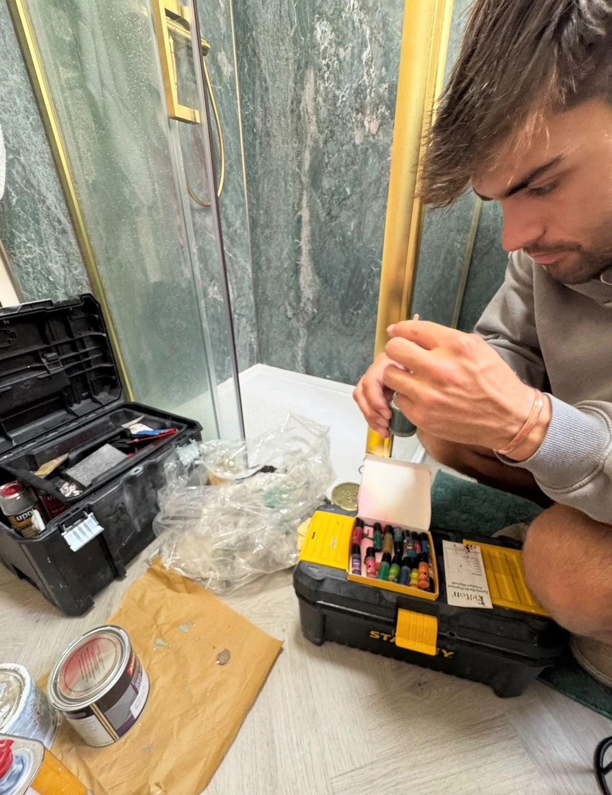Johnnie preparing materials for a surface repair